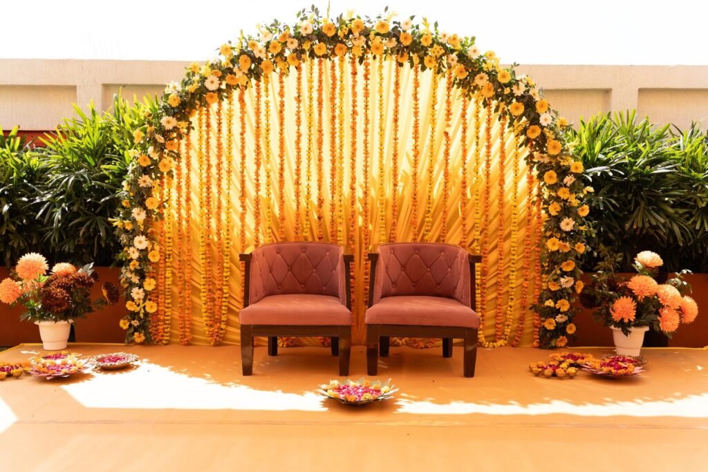 Gold curtain backdrop and seating at a Lucknow wedding ceremony by Tathastu Events