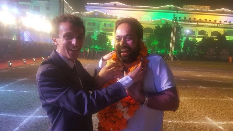 Tathastu team member garlanded at an event in Lucknow