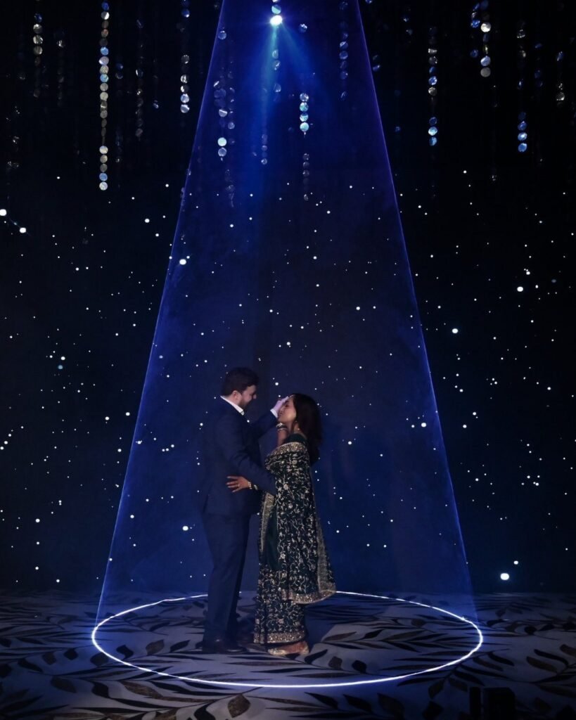Couple dancing under a spotlight at a private celebration in Lucknow