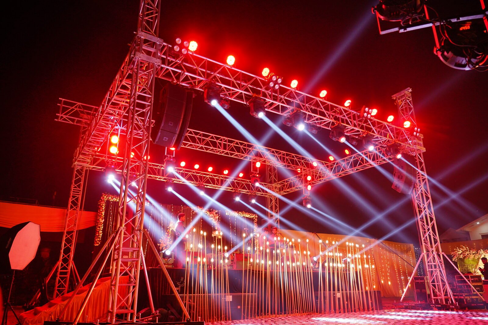 Truss rig with moving heads and beam lights at a Tathastu event in Lucknow