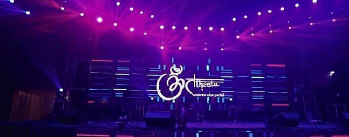 Tathastu branded stage with purple lighting in Lucknow