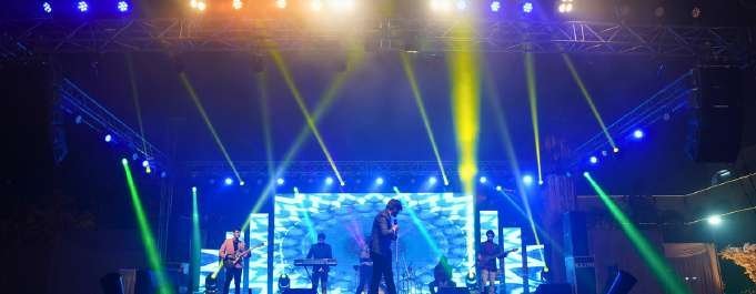 Concert stage with green and yellow beam lighting in Lucknow
