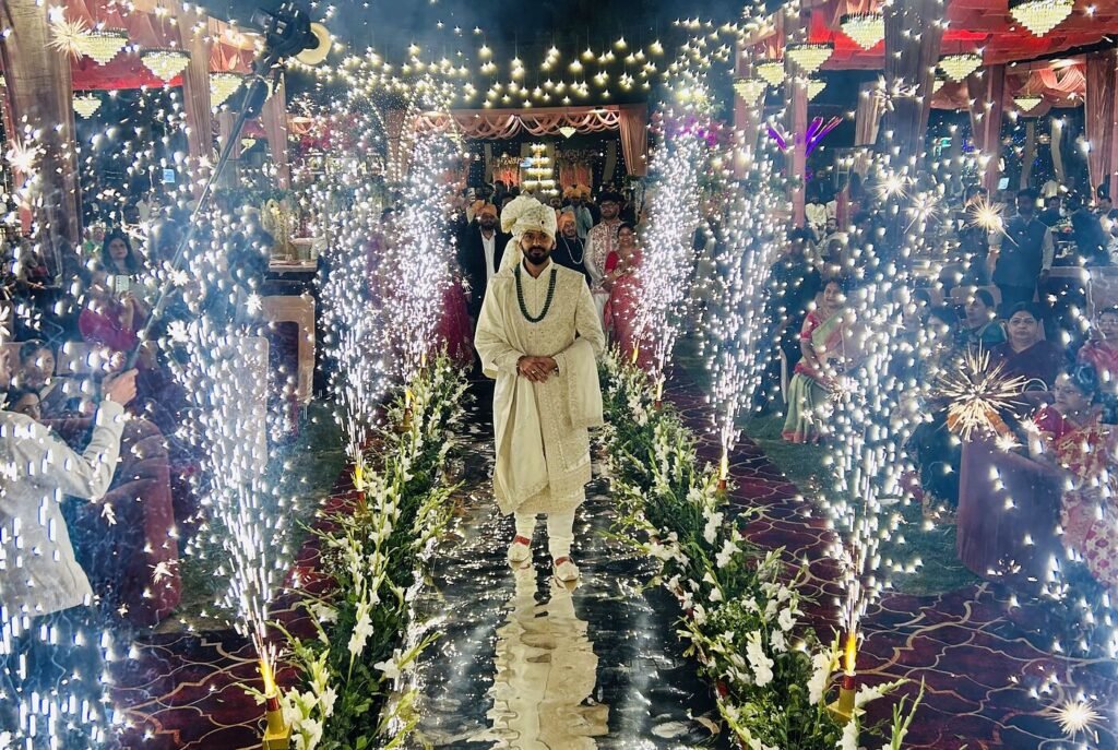 Floral stage with idol and sparkler fountains at a Lucknow celebration